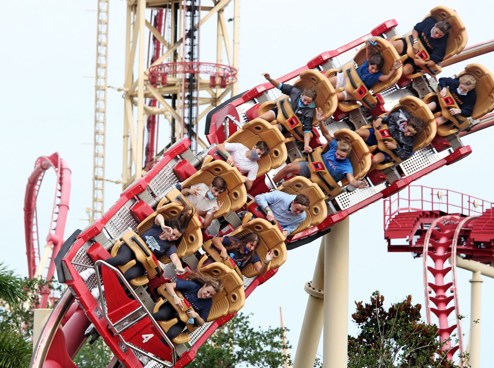 Visitors ride a roller coaster at the Universal Studios theme park in Orlando after it reopened on June 5.