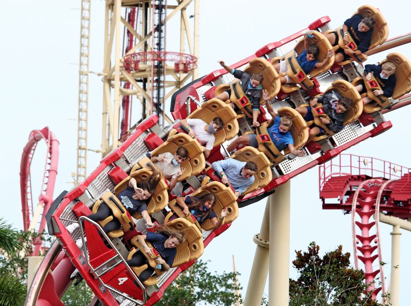 Visitors ride a roller coaster at the Universal Studios theme park in Orlando after it reopened on June 5.