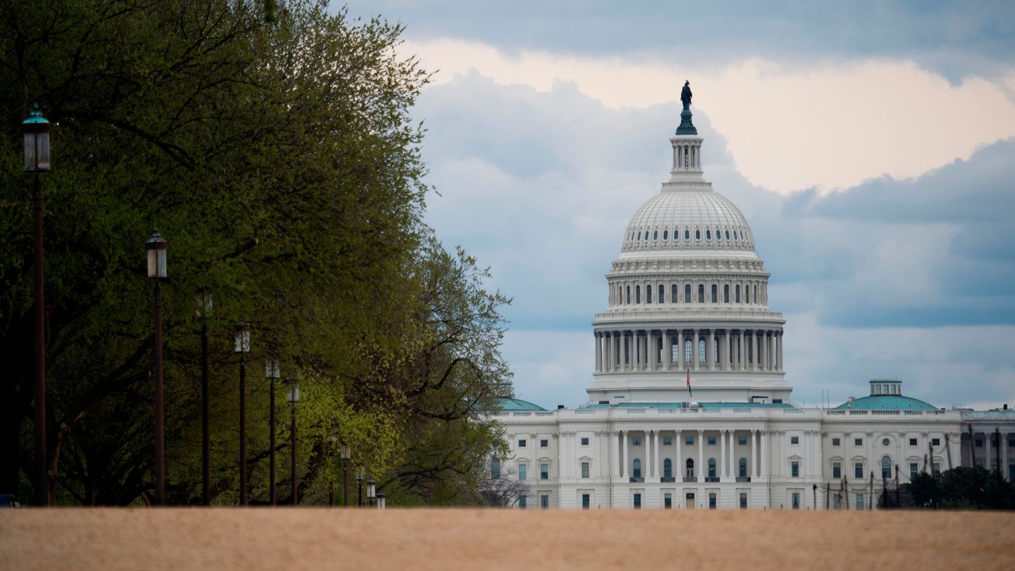 The US Capitol is seen on an empty National Mall in Washington, DC on March 31, 2020. - To prevent the spread of coronavirus, COVID-19, , Virginia, Maryland and Washington, DC, all announced March 30 stay-at-home orders, which strongly discourage residents from leaving home, except for essential trips like grocery or pharmacy shopping, or to travel for work. (Photo by Andrew Caballero-Reynolds/AFP/Getty Images)