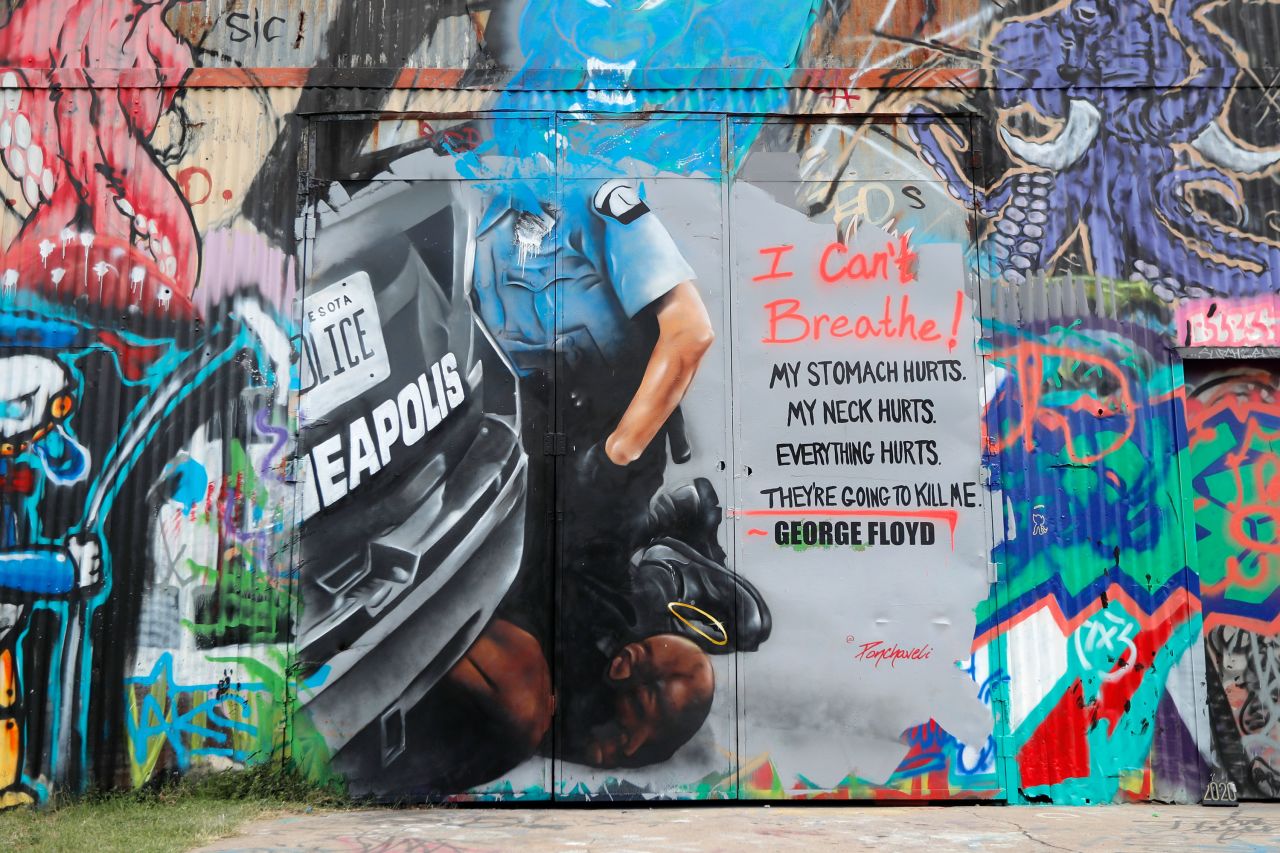 This mural in Dallas, painted by Theo Ponchaveli, depicts police officer Derek Chauvin with his knee on Floyd's neck.