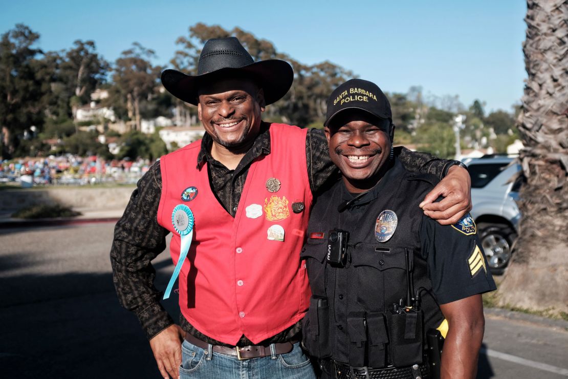 Rayshun Drayton, right, and a community member at a festival in Santa Barbara.