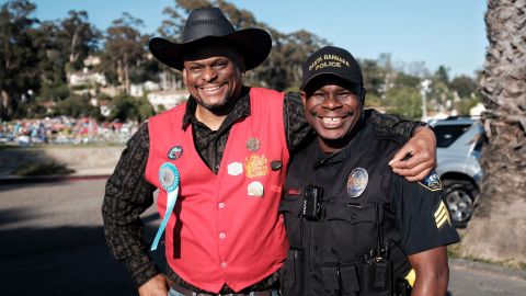Rayshun Drayton, right, and a community member at a festival in Santa Barbara.