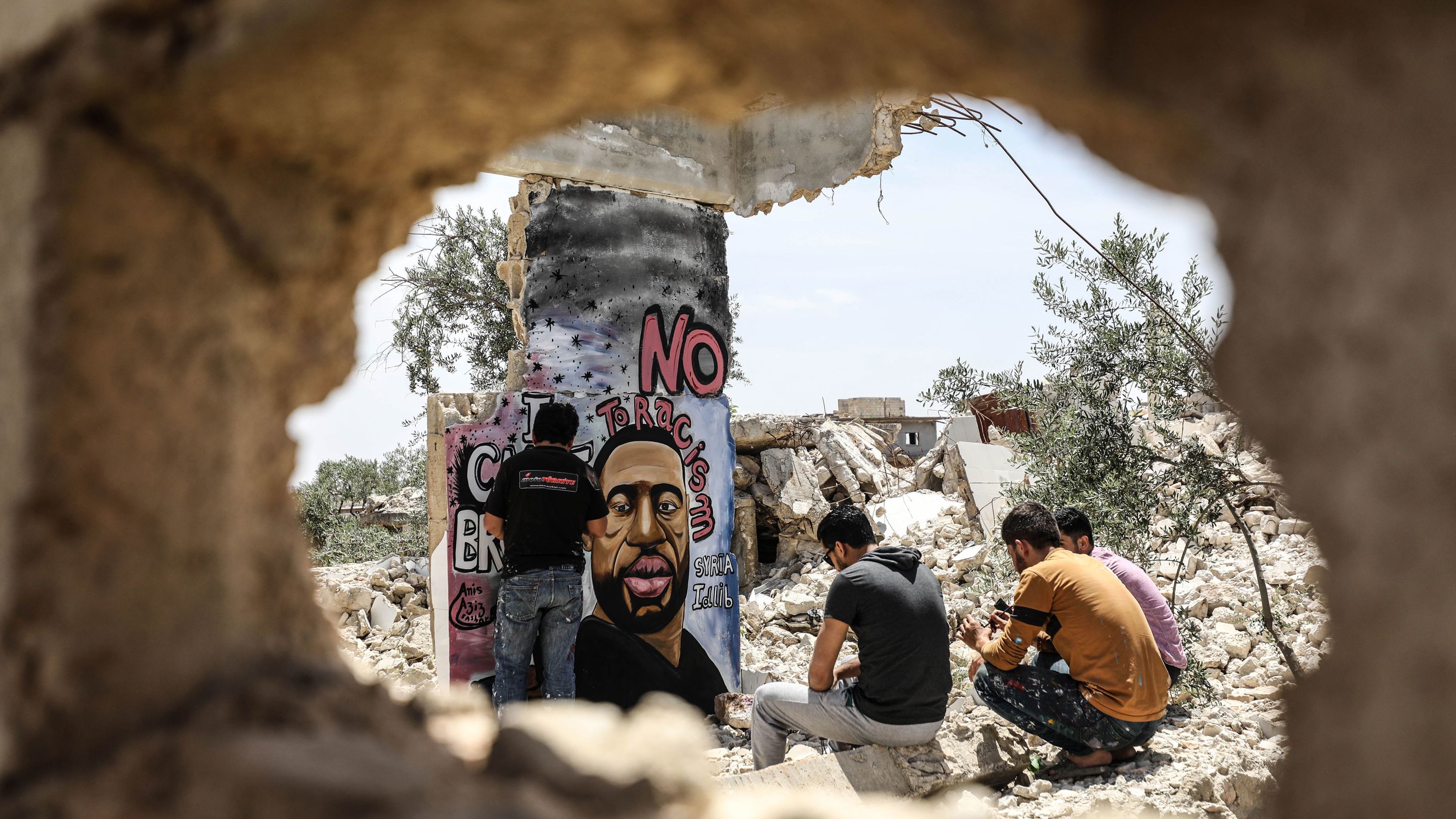Graffiti artist Aziz Asmar paints a Floyd mural in Idlib, Syria, on June 2.