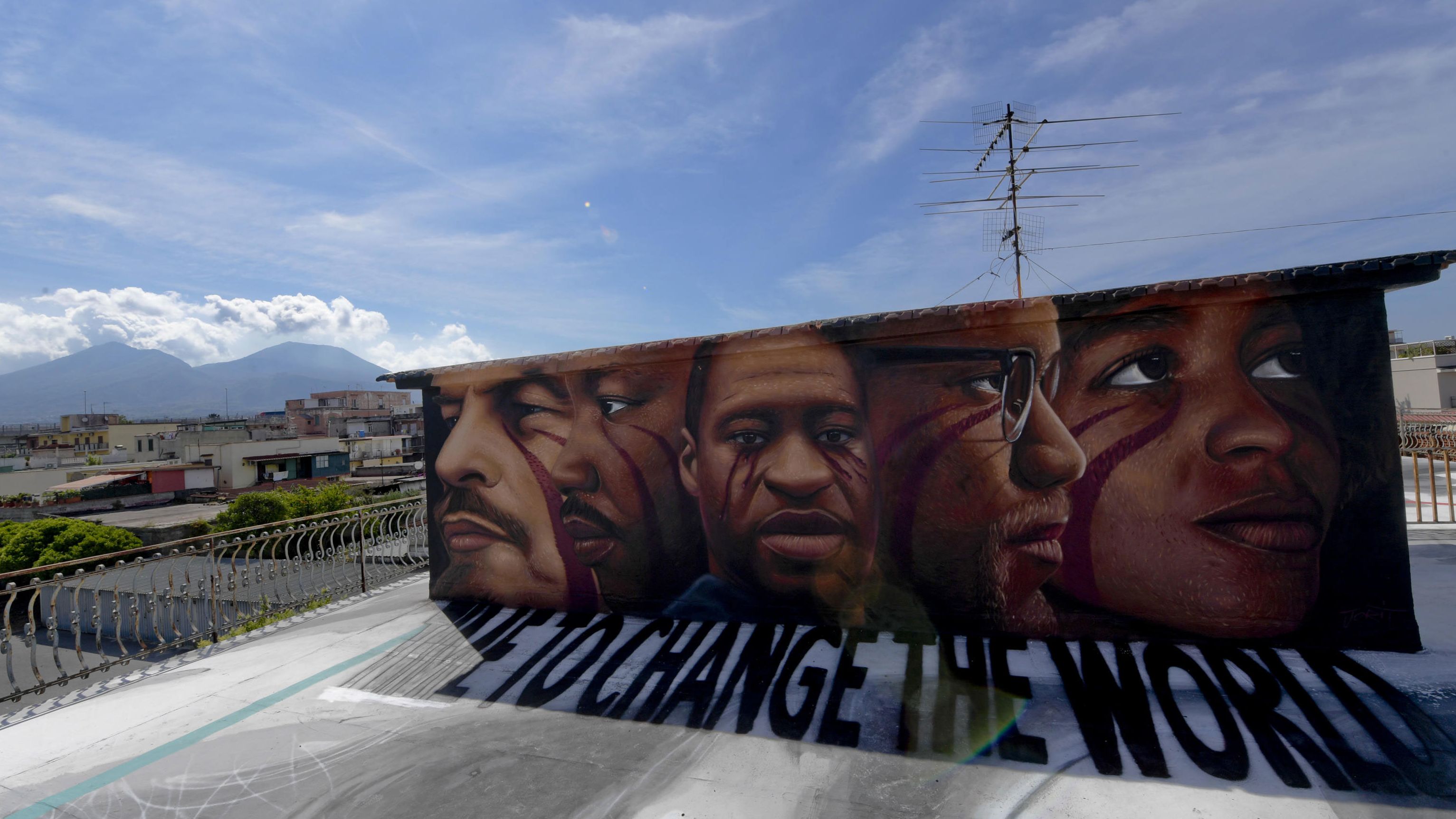 Floyd is seen at the center of this mural painted by street artist Jorit Agoch in Naples, Italy. The faces, from left, are Vladimir Lenin, Martin Luther King Jr., Floyd, Malcolm X and Angela Davis.