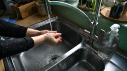 A woman washes her hands in a kitchen sink. PA Photo. Picture date: Saturday March 14, 2020. Photo credit should read: Ben Birchall/PA Wire (Photo by Ben Birchall/PA Images via Getty Images)