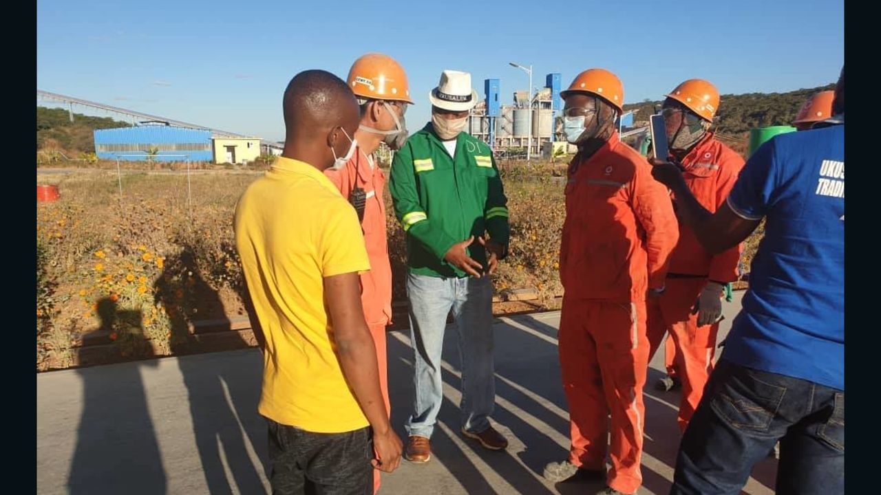 Mayor of Lusaka Miles Sampa asks staff at a Zambian cement factory about reports 100 Zambian workers have been prohibited from leaving the site during the Covid-19 pandemic.