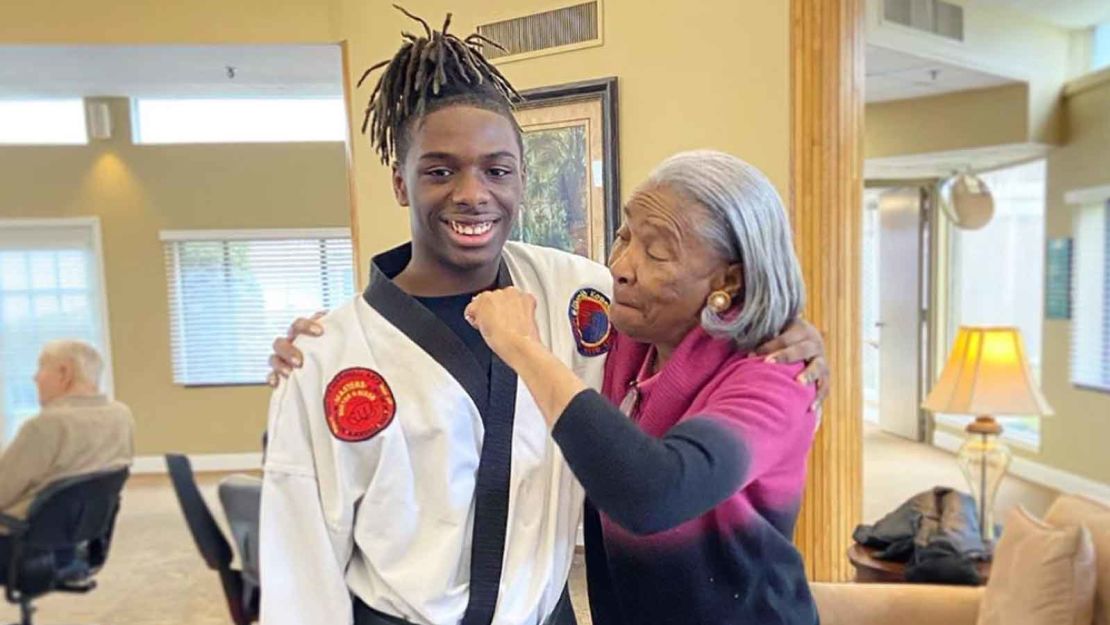 In a photo taken pre-social distancing, Wall poses with a "super nana" at the local nursing home where he provided karate classes to senior citizens. 

