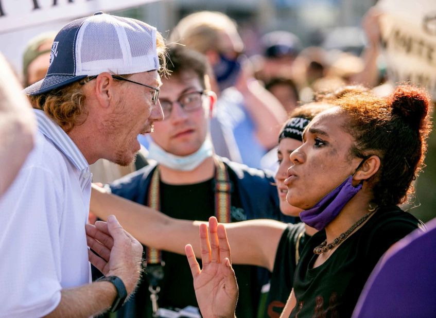 Jessica Moore attempts to hold dialogue with a counter-protester while rallying in Anna, Illinois, on June 4.