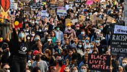 Demonstrators attend a Black Lives Matter protest to express solidarity with US protestors in Sydney on June 6, and demand an end to frequent Aboriginal deaths in custody in Australia.