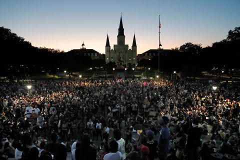 People attend a rally outside Jackson Square in New Orleans on June 5.