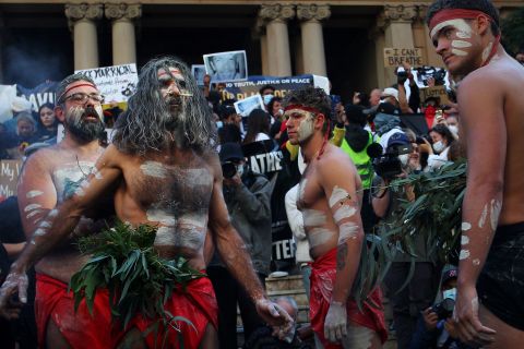 Aboriginal protesters conduct a traditional smoking ceremony at Town Hall in Sydney, Australia, on June 6.