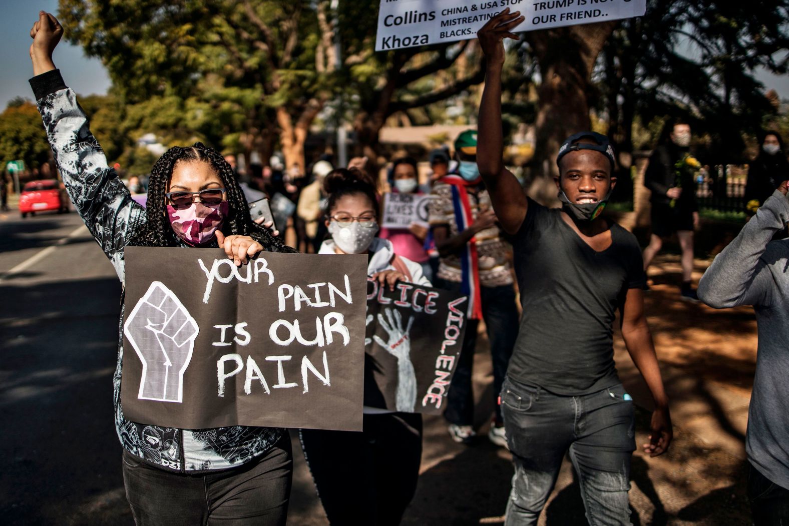 People march from the US Embassy in Pretoria, South Africa, towards the President's office.
