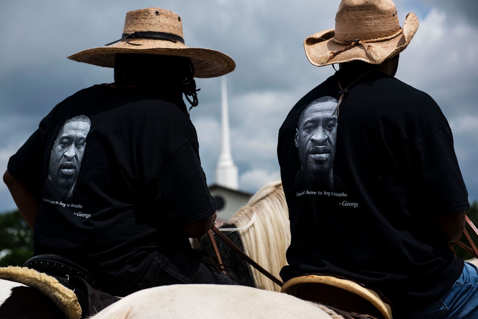 Members of a local Black Cowboys club ride their horses through the parking lot outside a Floyd memorial service in Raeford, North Carolina, on Saturday.