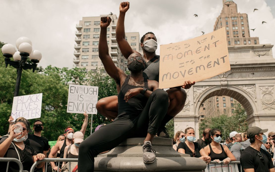 Demonstrators wear masks as they denounce systemic racism and the police killings of black Americans in Washington Square Park in the borough of Manhattan on June 6, 2020 in New York City.