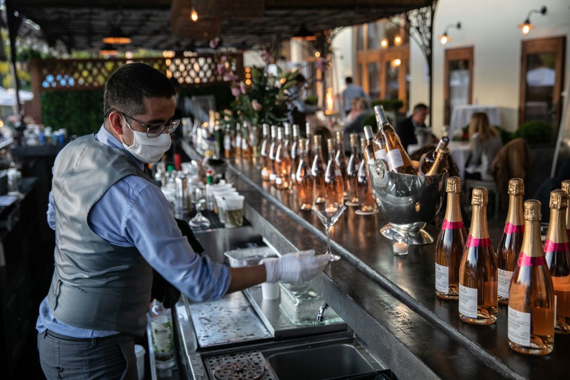 A bartender serves drinks at L'escale restaurant  in Greenwich, Connecticut.