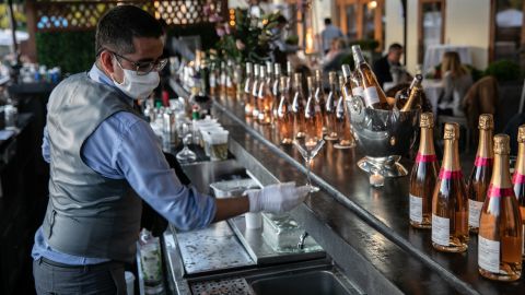 A bartender serves drinks at L'escale restaurant  in Greenwich, Connecticut.
