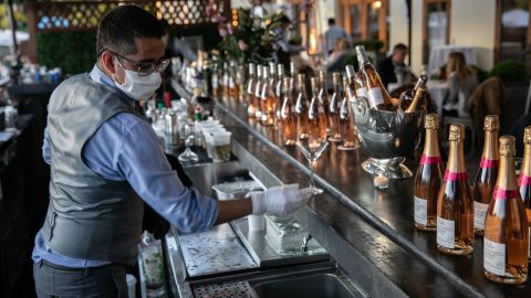 A bartender serves drinks at L'escale restaurant in Greenwich, Connecticut.