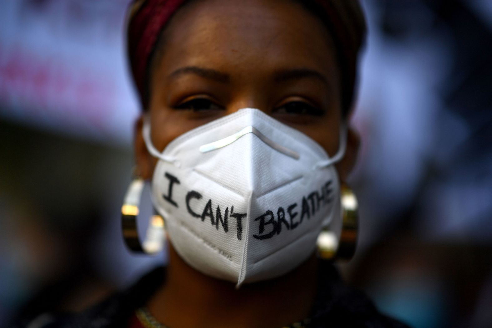 A woman wears a mask during a demonstration in Madrid on June 7.