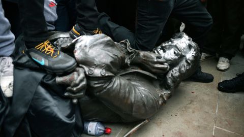 Protesters pull down a statue of slave trader Edward Colston during a Black Lives Matter protest rally on College Green, Bristol, England, Sunday June 7, 2020. 