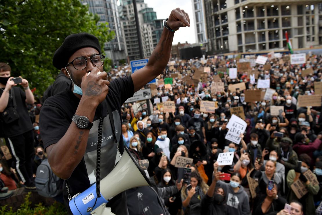An activist addresses the crowd near the US Embassy in London.
