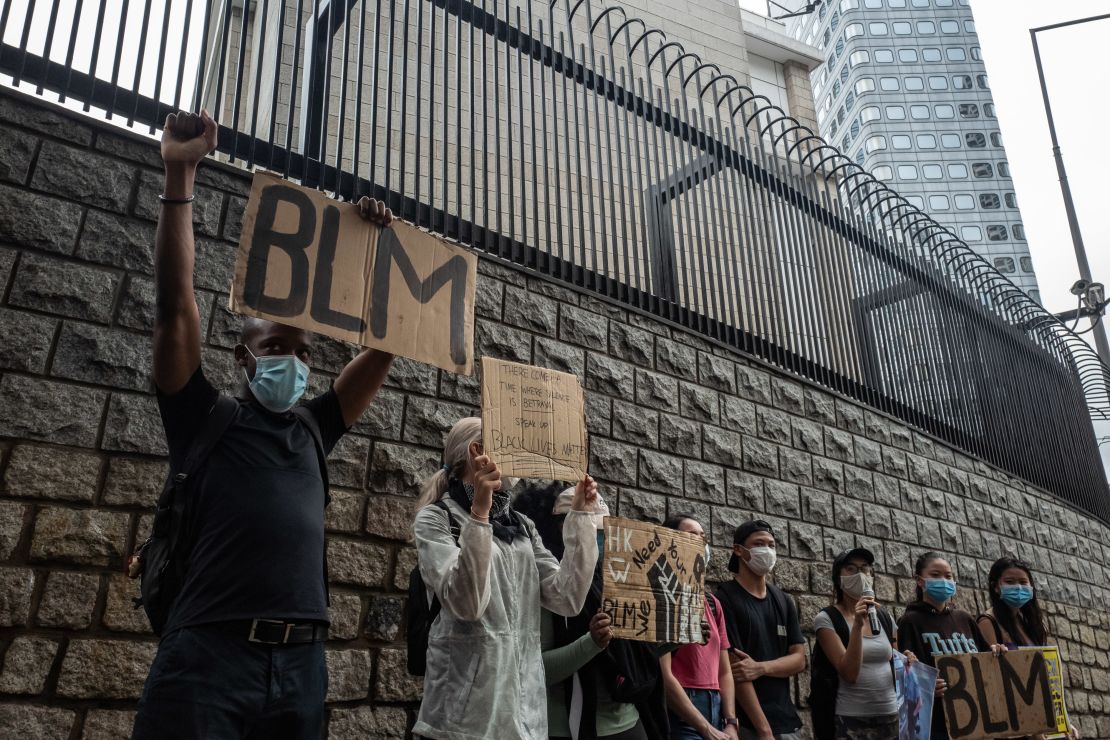 Small crowds gather outside the US Embassy in Hong Kong.