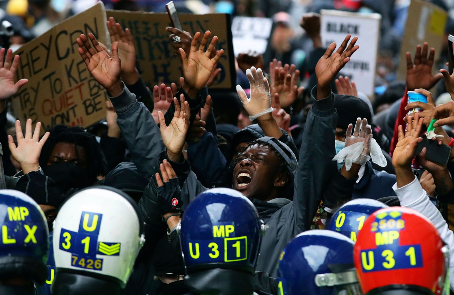 Police clash with protesters during a Black Lives Matter protest rally in Westminster, London on Sunday, June 7.