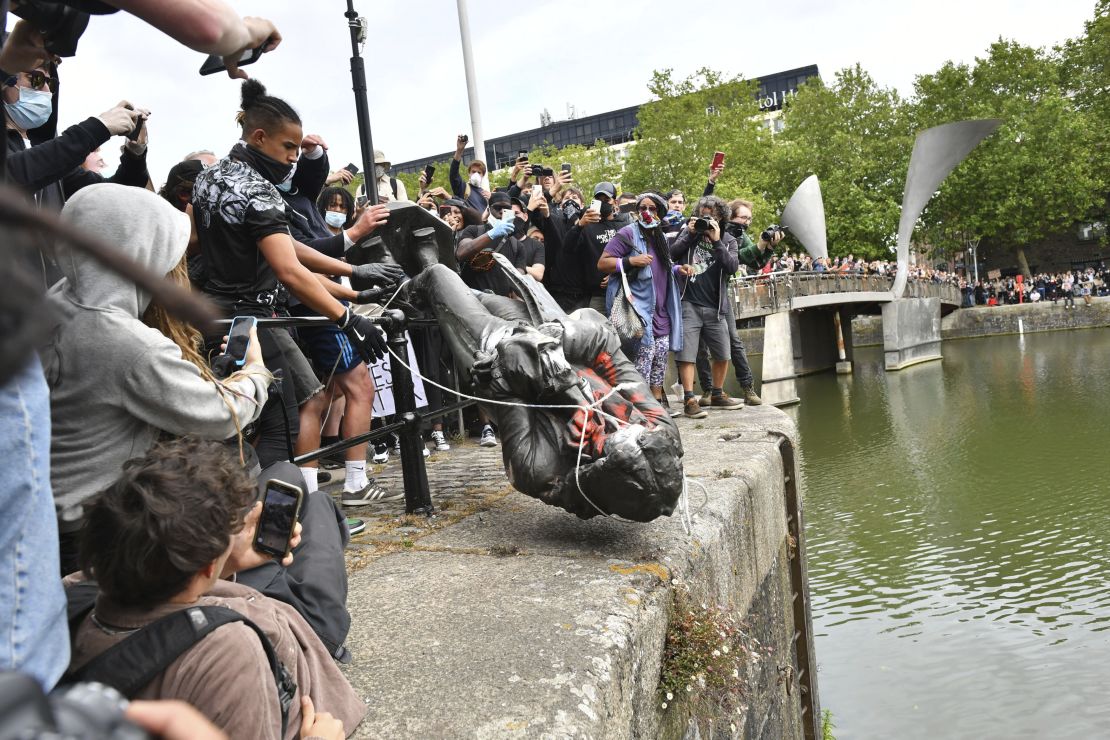 Protesters throw a statue of slave trader Edward Colston into Bristol harbor, during a Black Lives Matter protest, in Bristol, England.
