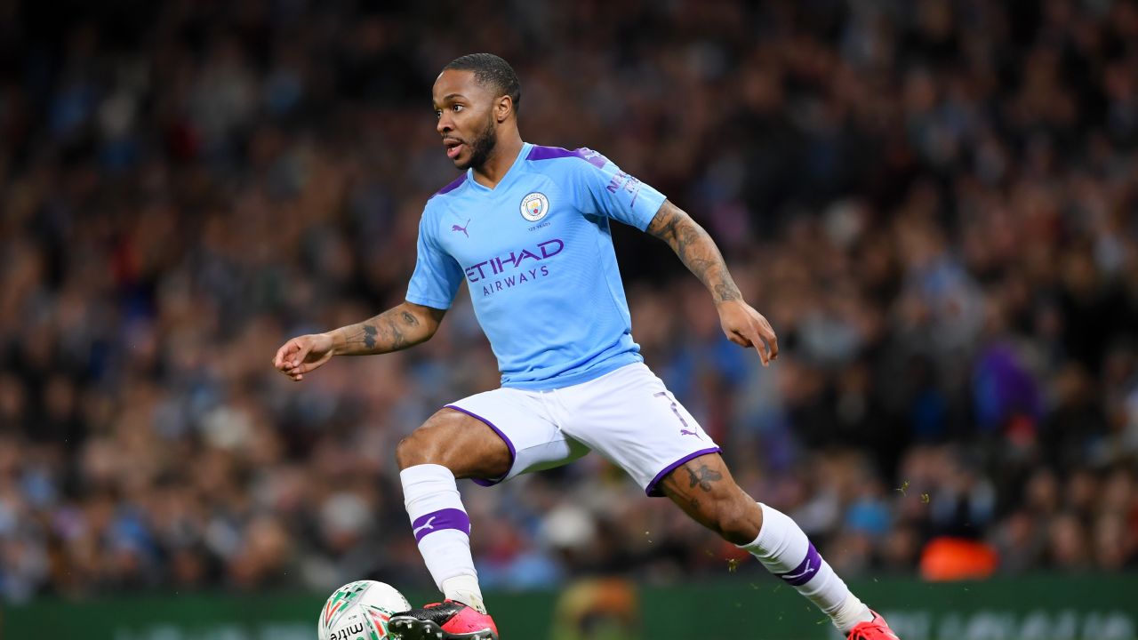 Sterling runs with the ball during the Carabao Cup Semi Final match against Manchester United.