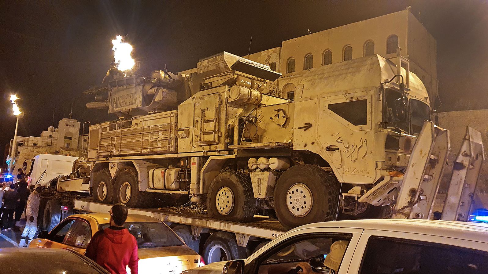 Forces loyal to Libya's UN-recognized government parade a Russian-made Pantsir air defense system truck in Tripoli on May 20, after its capture from forces loyal to Khalifa Haftar at al Watiya airbase.