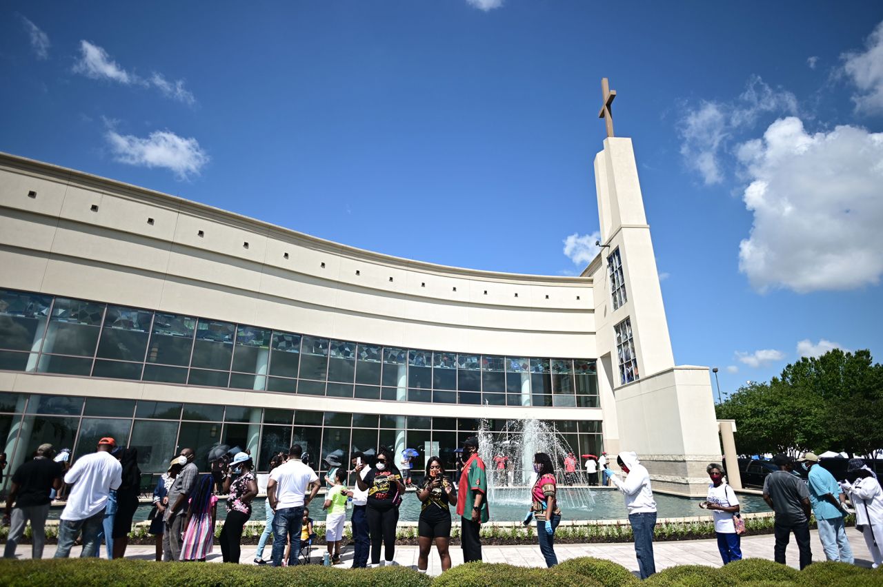 People line up to attend Floyd's public viewing in Houston. To comply with social-distancing rules, only 15 masked guests were allowed inside the church at a time. 