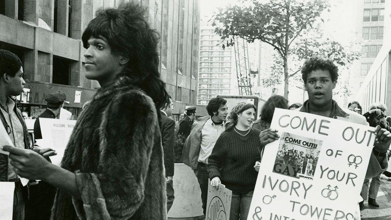 Marsha P. Johnson handing out flyers in support of gay students at New York University in 1970.