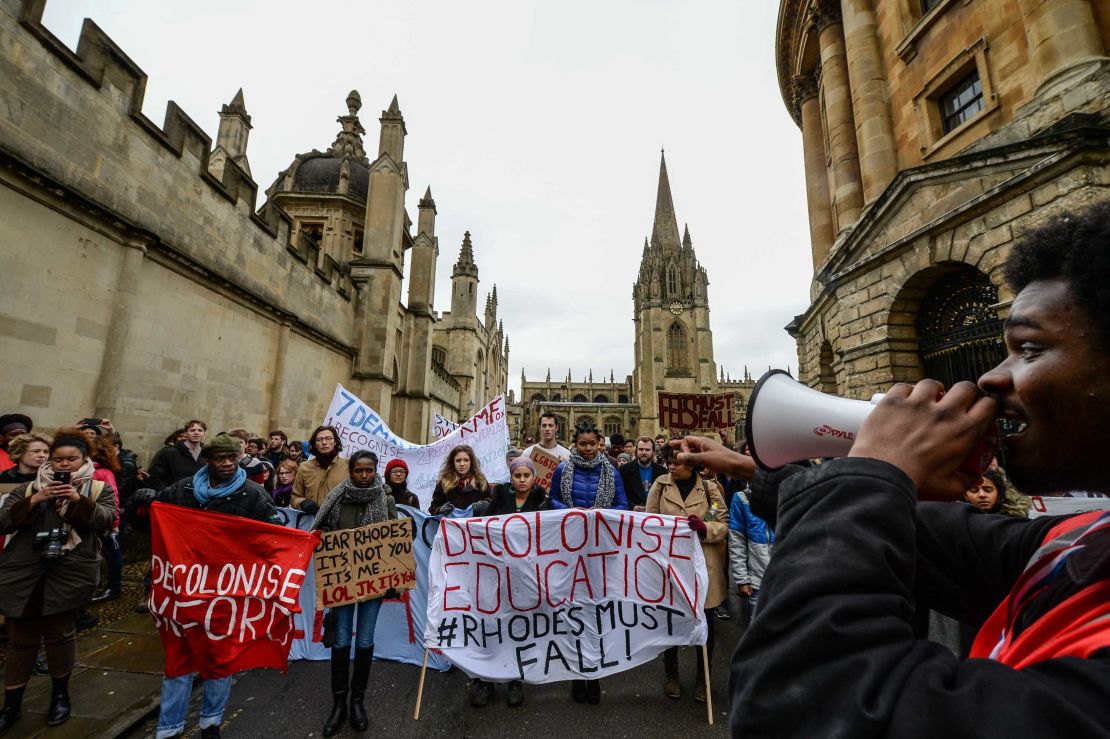 Students demonstrate outside Oxford University's All Souls College where a staute of Christopher Codrington is based which they are campaigning to be removed from the building on March 9, 2016 in Oxford, England. The demonstrators are calling for statues of colonial era figures including Cecil Rhodes and Queen Victoria to removed from university campuses. Cecil Rhodes was a british businessman and politician in South Africa, who served as Prime Minister of the Cape Colony from 1890 to 1896.  