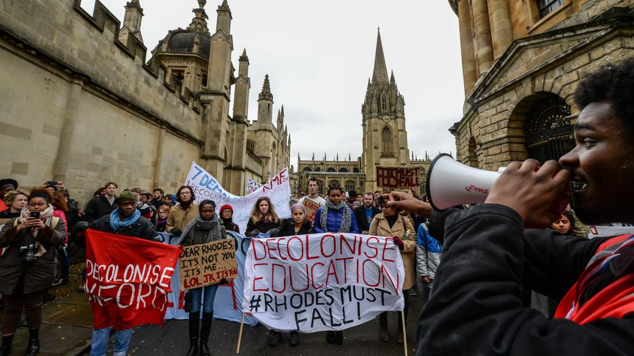 Students demonstrate outside Oxford University's All Souls College where a staute of Christopher Codrington is based which they are campaigning to be removed from the building on March 9, 2016 in Oxford, England. The demonstrators are calling for statues of colonial era figures including Cecil Rhodes and Queen Victoria to removed from university campuses. Cecil Rhodes was a british businessman and politician in South Africa, who served as Prime Minister of the Cape Colony from 1890 to 1896.