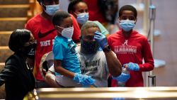 Mourners pass by the casket of George Floyd during a public visitation for Floyd at the Fountain of Praise church in Houston, Monday, June 8, 2020. (AP Photo/David J. Phillip, Pool)