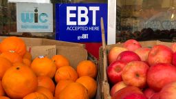 OAKLAND, CALIFORNIA - DECEMBER 04: A sign noting the acceptance of electronic benefit transfer (EBT) cards that are used by state welfare departments to issue benefits is displayed at a grocery store on December 04, 2019 in Oakland, California. Nearly 700,000 people are set to lose their food stamp benefits after the Trump administration announced plans to reform the Supplemental Nutrition Assistance Program, or SNAP.  (Photo by Justin Sullivan/Getty Images)
