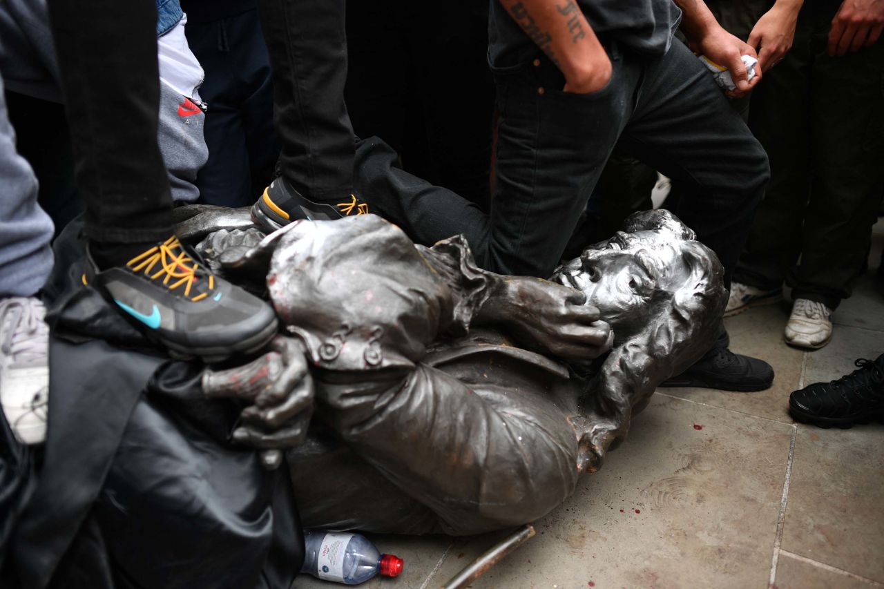 Protesters pull down a statue of slave trader Edward Colston during a Black Lives Matter protest rally in Bristol, England on Sunday.