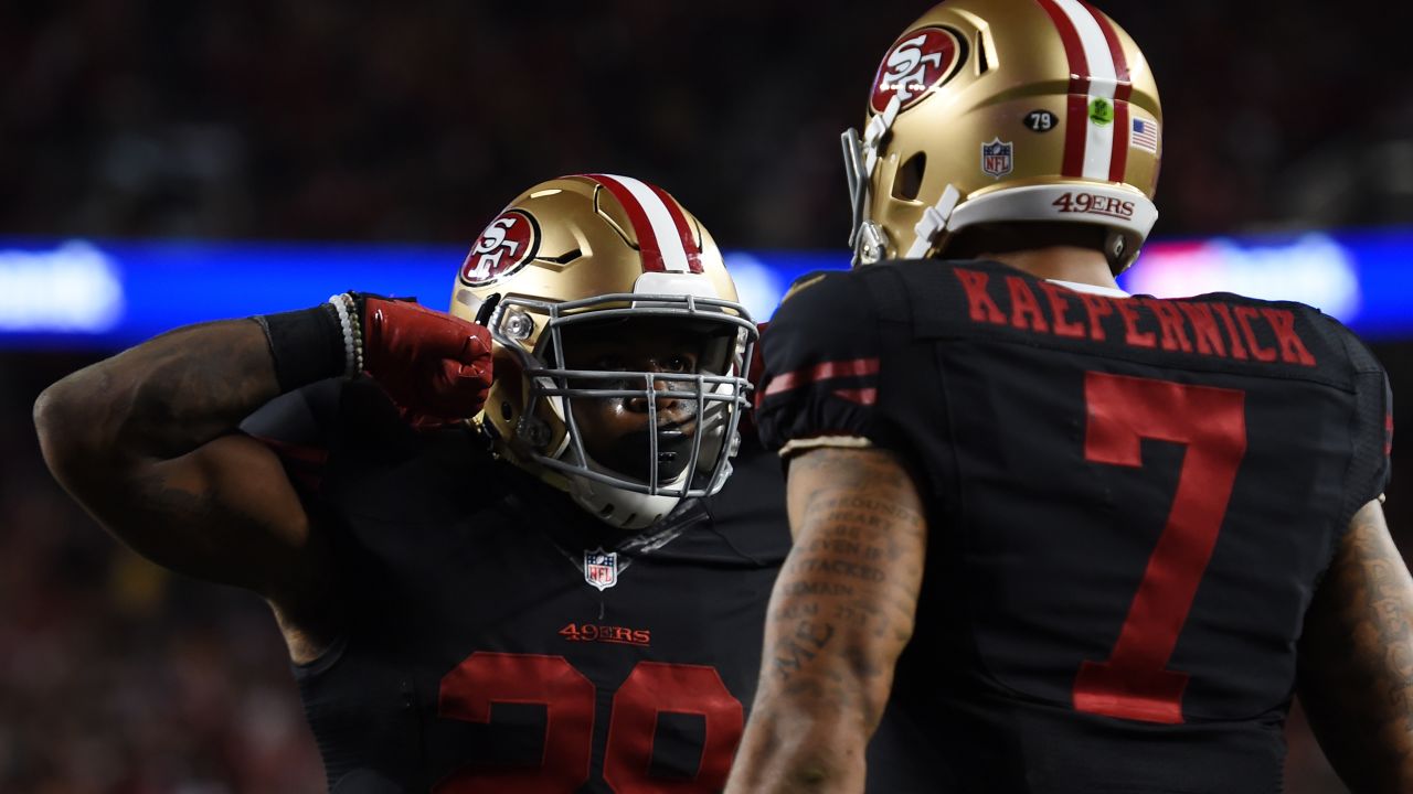 Carlos Hyde celebrates with Colin Kaepernick after scoring for the 49ers in September 2015.
