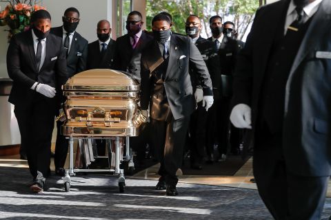 Pallbearers bring George Floyd's casket into the Fountain of Praise church in Houston on Tuesday, June 9. Floyd will be buried next to his mother, according to the Fort Bend Memorial Planning Center.