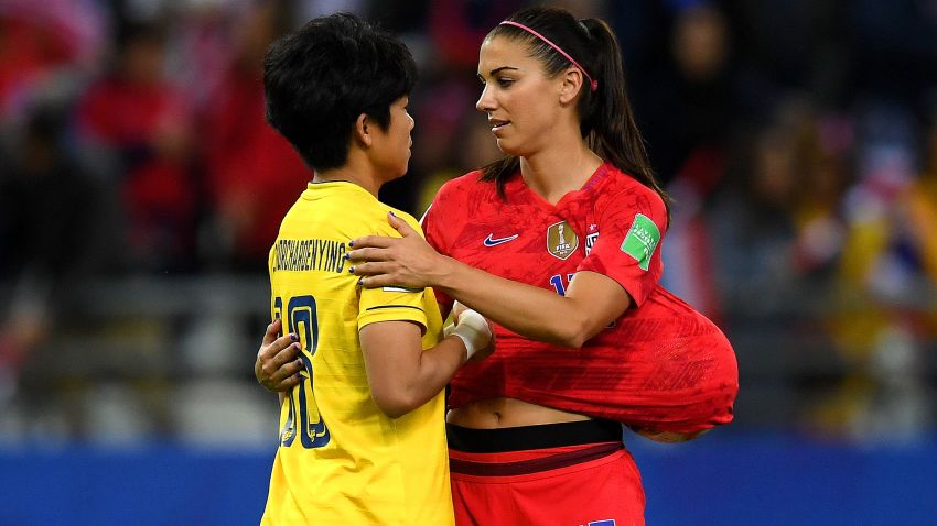 Alex Morgan of the USA consoles Sukanya Chor Charoenying of Thailand after USA's victory in the 2019 FIFA Women's World Cup