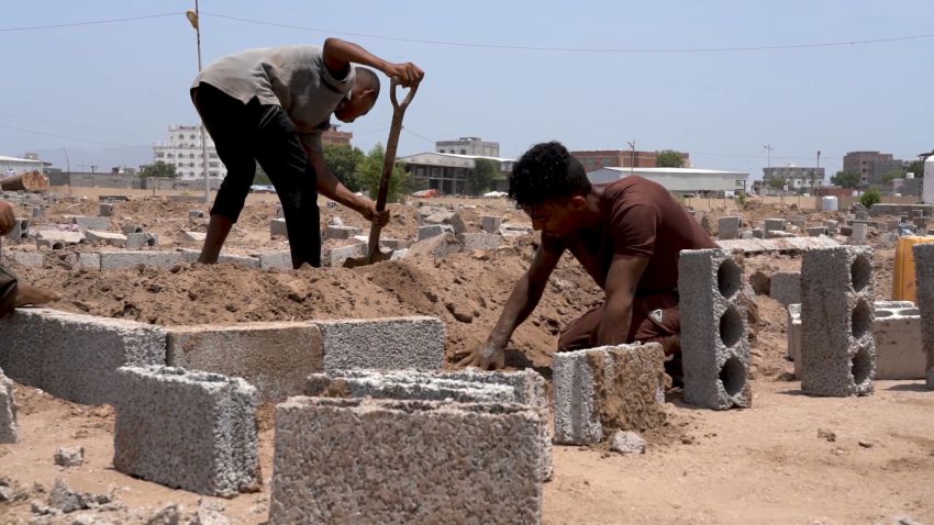 Grave diggers work from dawn to sunset in Al-Radwan cemetery in Aden.