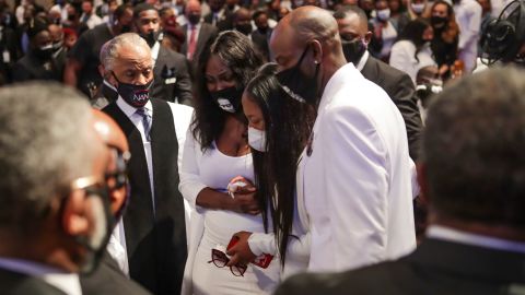 Family members react as they view the casket during the funeral of George Floyd on Tuesday at The Fountain of Praise church in Houston, Texas.