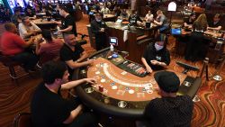 LAS VEGAS, NEVADA - JUNE 04:  Guests play blackjack at tables with only three players allowed at a time at the Red Rock Resort after the property opened for the first time since being closed on March 17 because of the coronavirus (COVID-19) pandemic on June 4, 2020 in Las Vegas, Nevada. Hotel-casinos throughout the state are opening today as part of a phased reopening of the economy with social distancing guidelines and other restrictions in place.  (Photo by Ethan Miller/Getty Images)