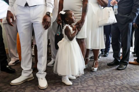 A young girl attends Floyd's funeral.