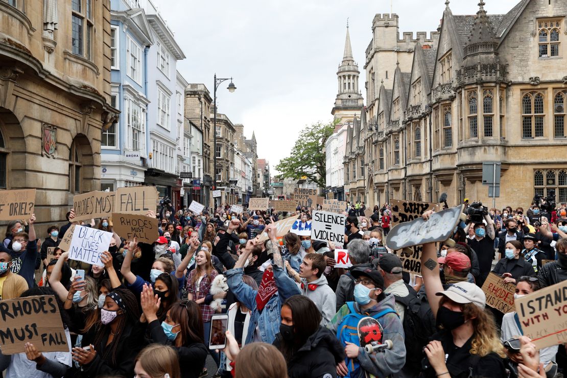 Protestors calling for the removal of the statue of British imperialist Cecil John Rhodes outside Oriel Cllege at the University of Oxford, two days after Colston's statue was removed.