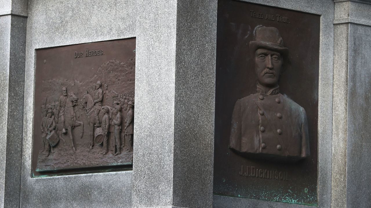Plaques in honor of Confederates are seen on the base of a monument in Hemming Park.