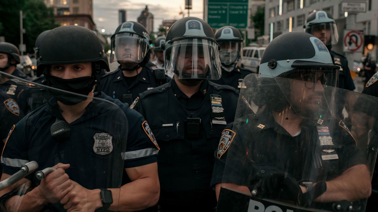 NEW YORK, NY - JUNE 02: NYPD officers block the entrance of the Manhattan Bridge as hundreds protesting police brutality and systemic racism attempt to cross into the borough of Manhattan from Brooklyn after a citywide curfew went into effect in New York City. Days of protest, sometimes violent, have followed in many cities across the country in response to the death of George Floyd while in police custody in Minneapolis, Minnesota on May 25th. (Photo by Scott Heins/Getty Images)