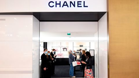Shop assistants welcoming customers to Chanel at Galeries Lafayette, on the first day of the department store's reopening in Paris in May.