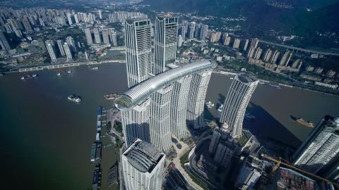 The 300-meter-long sky bridge, called The Crystal, connects four of the eight skyscrapers that make up the Raffles City Chongqing complex.