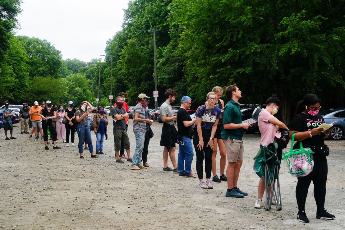 People wait in line to vote in Georgia's Primary Election on June 9, 2020 in Atlanta.