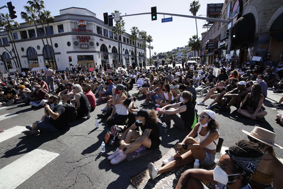 Demonstrators stage a sit-in on Tuesday, June 9, on Sunset Boulevard in Los Angeles during a protest over the death of George Floyd.